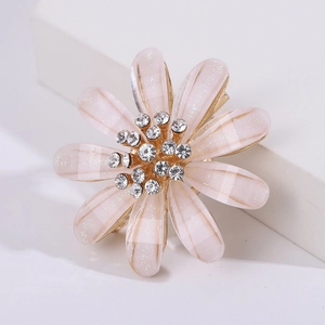Elegant pink flower brooch with sparkling rhinestones and golden base for summer coats