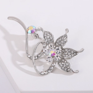 Detailed macro view of rhinestone flower brooch with silver plating and AB crystals