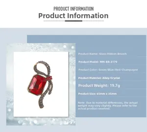 Detailed view of alloy ribbon brooch with large red glass gemstone and grey rhinestones