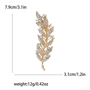 Broche élégante en forme de plume dorée avec strass dimensions 7,9 cm x 3,1 cm pour vestes