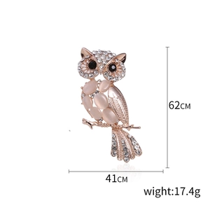 Chic cat-eye stone owl brooch with rose gold finish and sparkling crystal accents