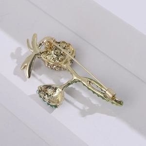 Detailed macro view of the gold alloy lotus brooch back featuring pin clasp and hollow structure