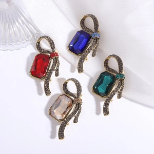 Elegant crystal bow brooches in four colors with vintage gold alloy and rectangular stones