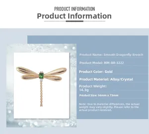 Detailed view of golden dragonfly brooch with green crystal and size specs 56mm by 73mm
