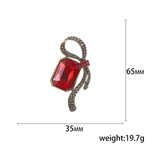 Vintage red rectangle glass crystal brooch with ribbon design in polished alloy setting