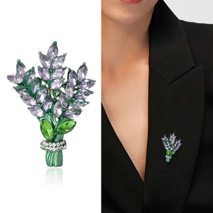 Exquisite purple crystal floral brooch with leaf accents on a black business suit blazer