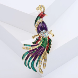 Macro shot of colorful peacock brooch with crystal rhinestones and enamel details