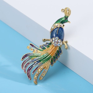 Detailed close-up of peacock brooch with colorful enamel feathers and sparkling rhinestones