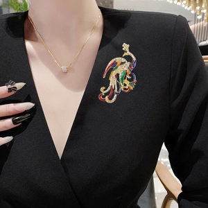 Exquisite vintage phoenix brooch with colorful enamel and crystals on elegant black attire