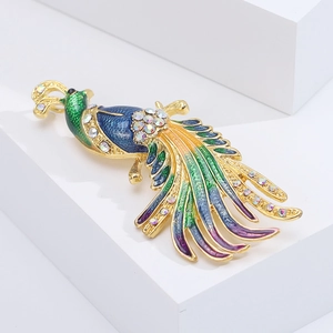 Detailed close-up of a vintage peacock brooch with colorful enamel and sparkling rhinestones