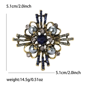 Detail view of Baroque vintage pearl brooch showing 5.1cm x 5.1cm size and rhinestone inlay