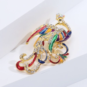 Detailed macro view of vibrant colorful phoenix brooch with sparkling rhinestones