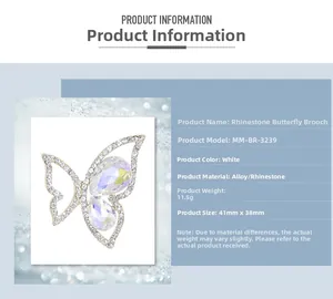 Detailed view of rhinestone butterfly brooch with dimensions 41mm x 38mm on blue background