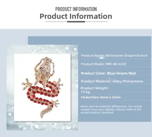 Detail view of gold alloy dragon brooch with red rhinestones and size specifications