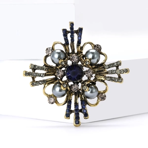 Vintage Baroque brooch with deep blue gemstone and grey pearls on gold metal base