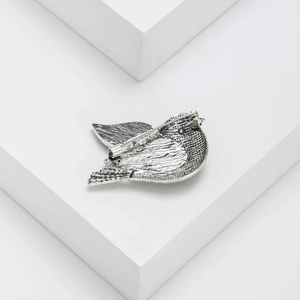Elegant silver bird brooch with abalone shell details and retro metal brushed texture