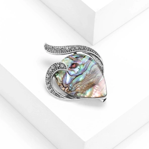 Vintage heart-shaped brooch featuring colorful abalone shell and crystal accents