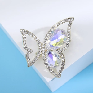 Detailed close-up of butterfly brooch with sparkling pear-shaped colorful rhinestones