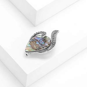 Teardrop abalone shell brooch with vintage silver frame and dark rhinestones on white stones