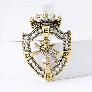 Vintage lion shield crown brooch with sparkling rhinestones in antique gold finish