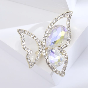 Macro view of the sparkling rhinestone butterfly brooch with golden wings and aurora crystals