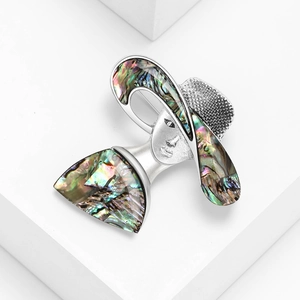 Fashionable abalone shell brooch featuring a lady in a sun hat silhouette with pearl details