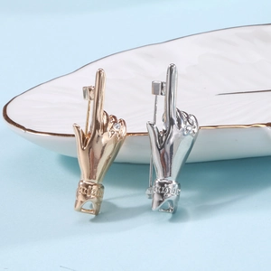 Hip hop style gold and silver middle finger gesture pins with crystal accent