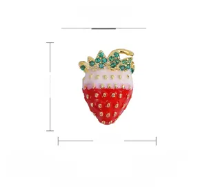 Macro shot showing 15mm by 11mm red strawberry brooch with green zircon leaves