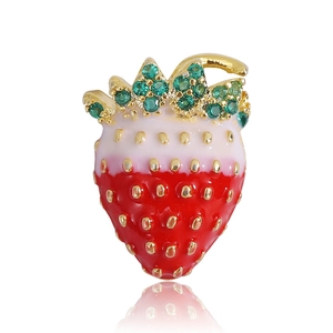 Detail showing red gradient enamel strawberry brooch with green zircon leaves and gold accents