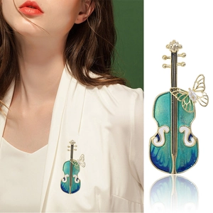 Broche violon exquise en émail turquoise avec papillon doré et accents de zircone