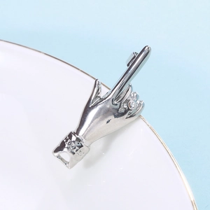 Hip hop style silver alloy necklace pendant with a creative hand gesture and small crystal