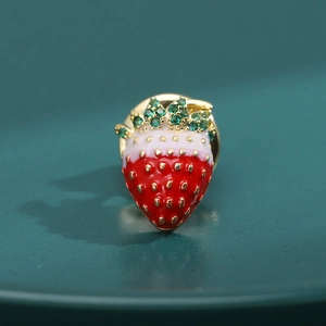 Exquisite strawberry brooch with red enamel, green zircon leaves, and gold metal finish