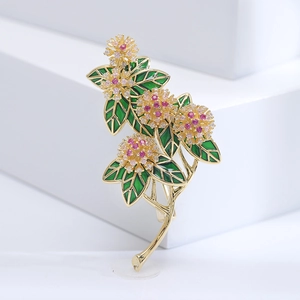 Luxurious flower brooch with green enamel leaves and sparkling pink zircon stones