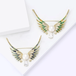 Luxury enamel angel wing brooch with natural pearl and teardrop zircon on white stands