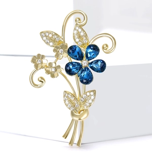 Broche bouquet élégante avec cristaux bleus et zircons scintillants en pavé de luxe
