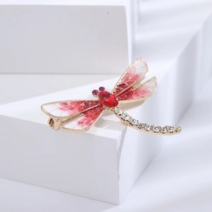 Elegante spilla a libellula dorata con ali in smalto rosso e cristalli brillanti