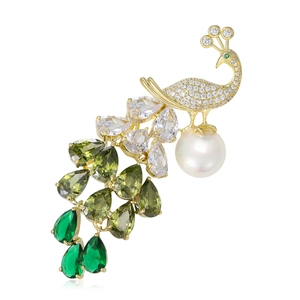 Elegant gold peacock brooch featuring sparkling zircons and a white round pearl drop