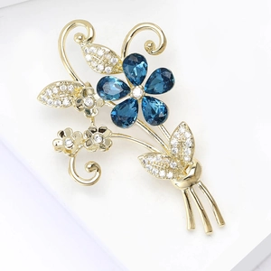 Élégante broche bouquet doré avec cristaux bleus et zircons brillants pour femme