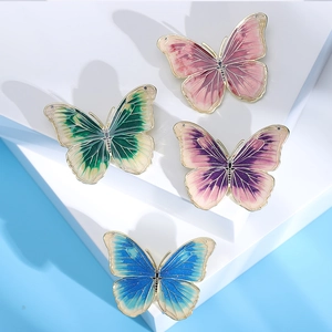 Elegant butterfly brooches with enamel gradient colors and metallic wings for suits