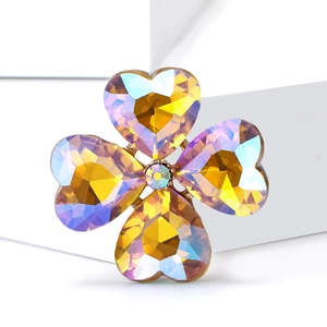 Macro shot of a four-leaf clover brooch with iridescent AB coating crystal heart petals