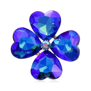Elegant four-leaf clover brooch with deep blue heart-cut crystals and gold metal setting