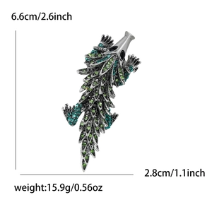 Detailed view of rhinestone lizard brooch with 6.6cm x 2.8cm size and weight dimensions