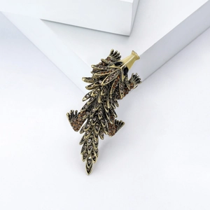 Vintage gold hedgehog brooch with sparkling brown and clear rhinestones on white blocks