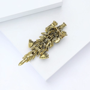 Detailed back view of vintage gold crocodile brooch showing the pin clasp and scale texture