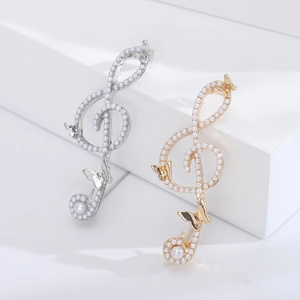 Elegant butterfly musical note brooch with pearls in gold and silver finish set