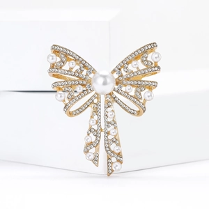 Elegant gold bow brooch with hollow engraving pearls and sparkling rhinestones
