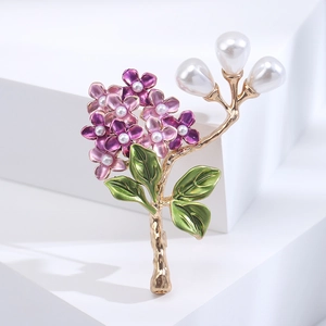 Macro shot of hydrangea brooch with purple enamel petals and elegant white pearls