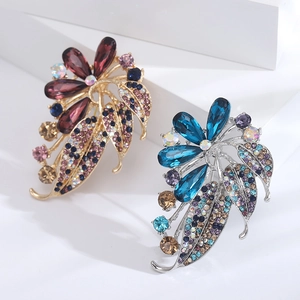Elegant rhinestone flower brooch set with crystal petals in gold and silver finish