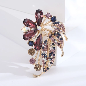 Macro shot of elegant floral brooch with purple crystals and multi-color rhinestones