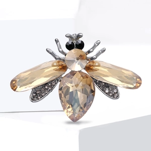 Sparkling crystal bee brooch with amber wings on white block for suit accessory